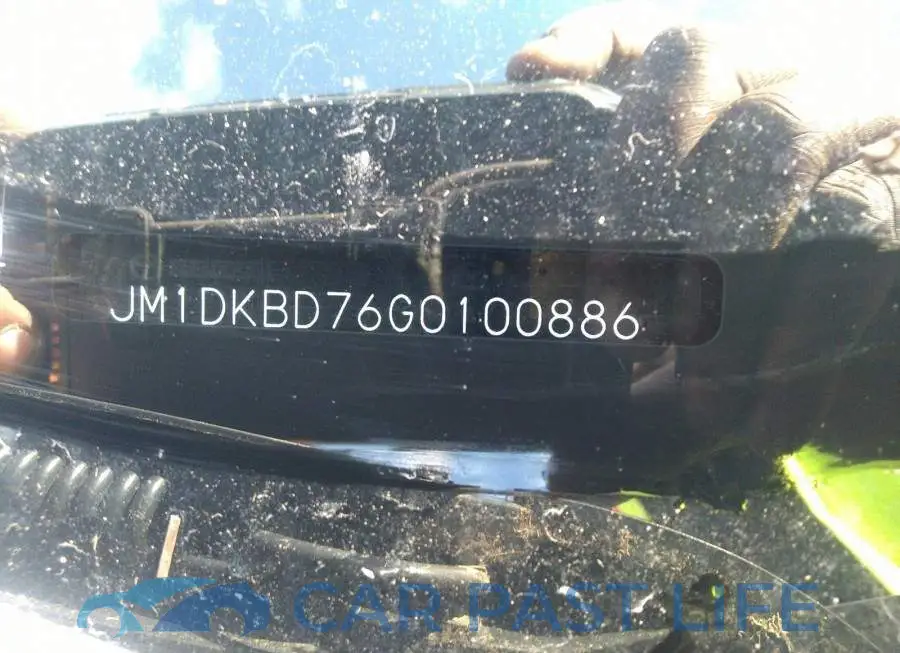 JM1DKBD76G0100886# 9