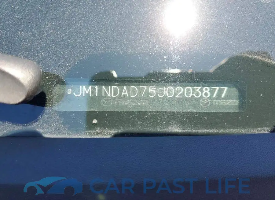 JM1NDAD75J0203877# 12